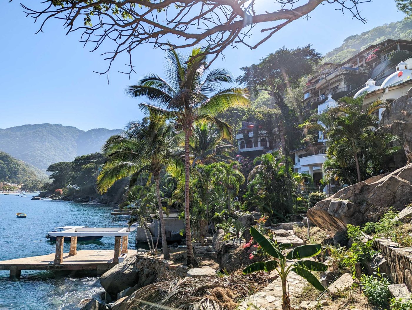 a dock on the shore of a tropical island.